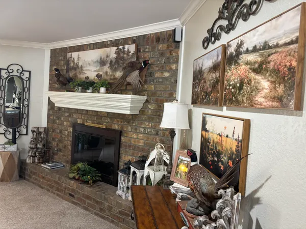 a kitchen with stainless steel appliances kitchen island granite countertop a refrigerator and a stove top oven