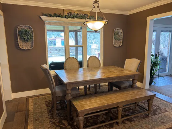 a kitchen with stainless steel appliances granite countertop a stove refrigerator and sink