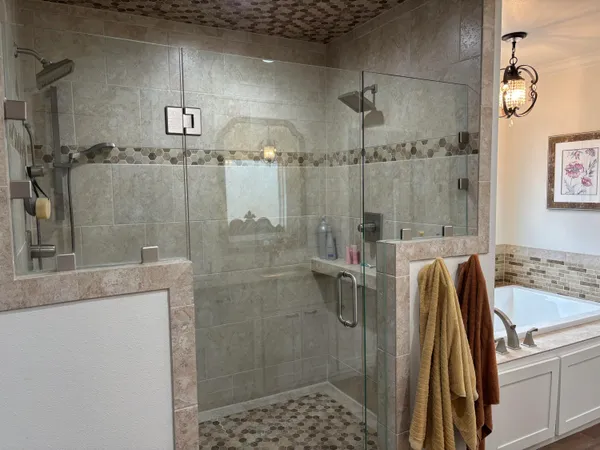 a bathroom with double vanity and a granite counter tops