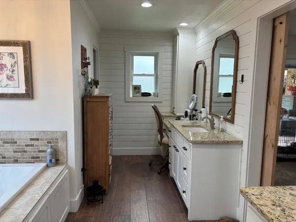 a bedroom with bed and window