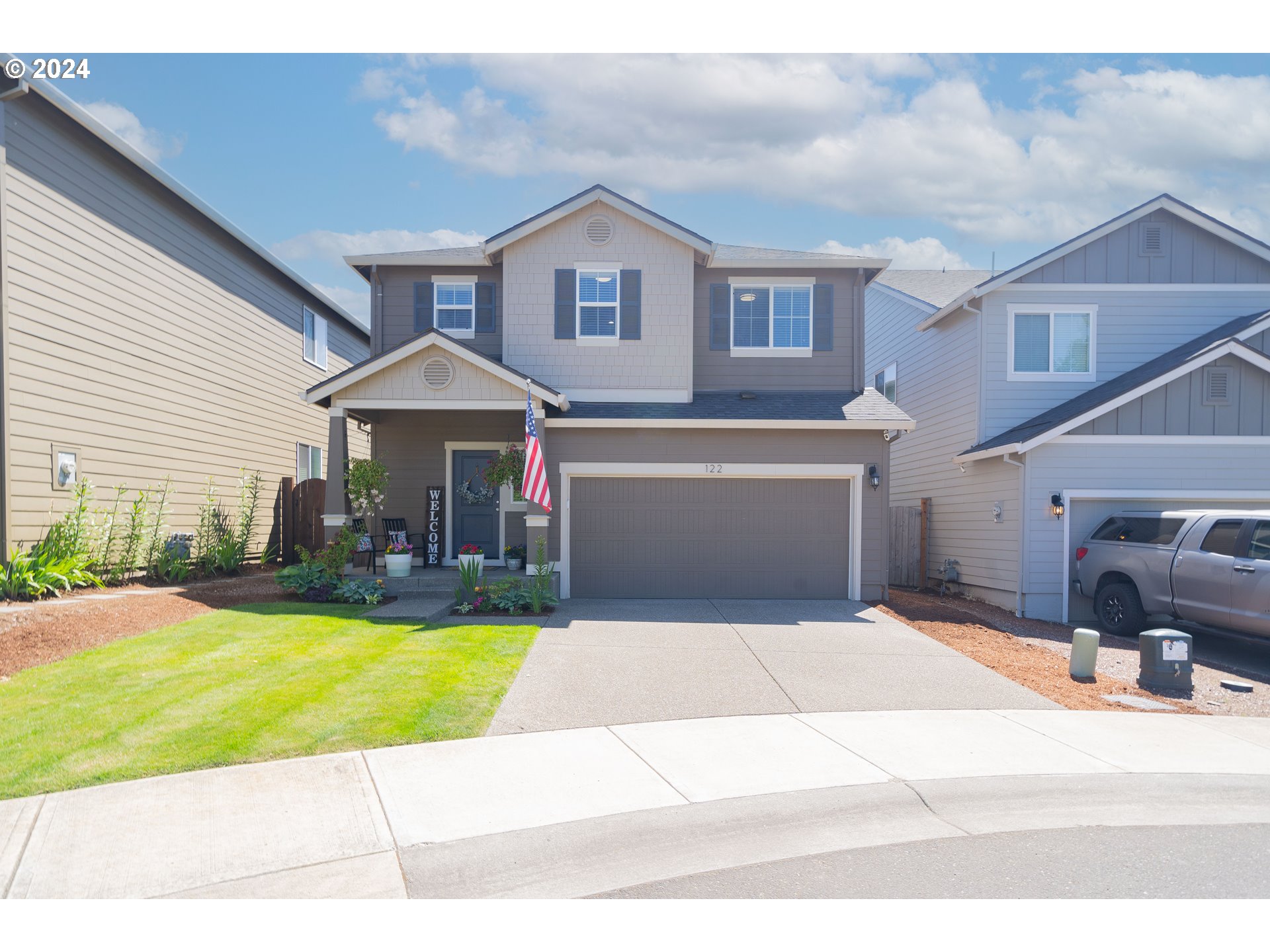 122 North 34th Court Ridgefield, WA 98642 - Photo 1 of 48 a view of a house with swimming pool and a yard