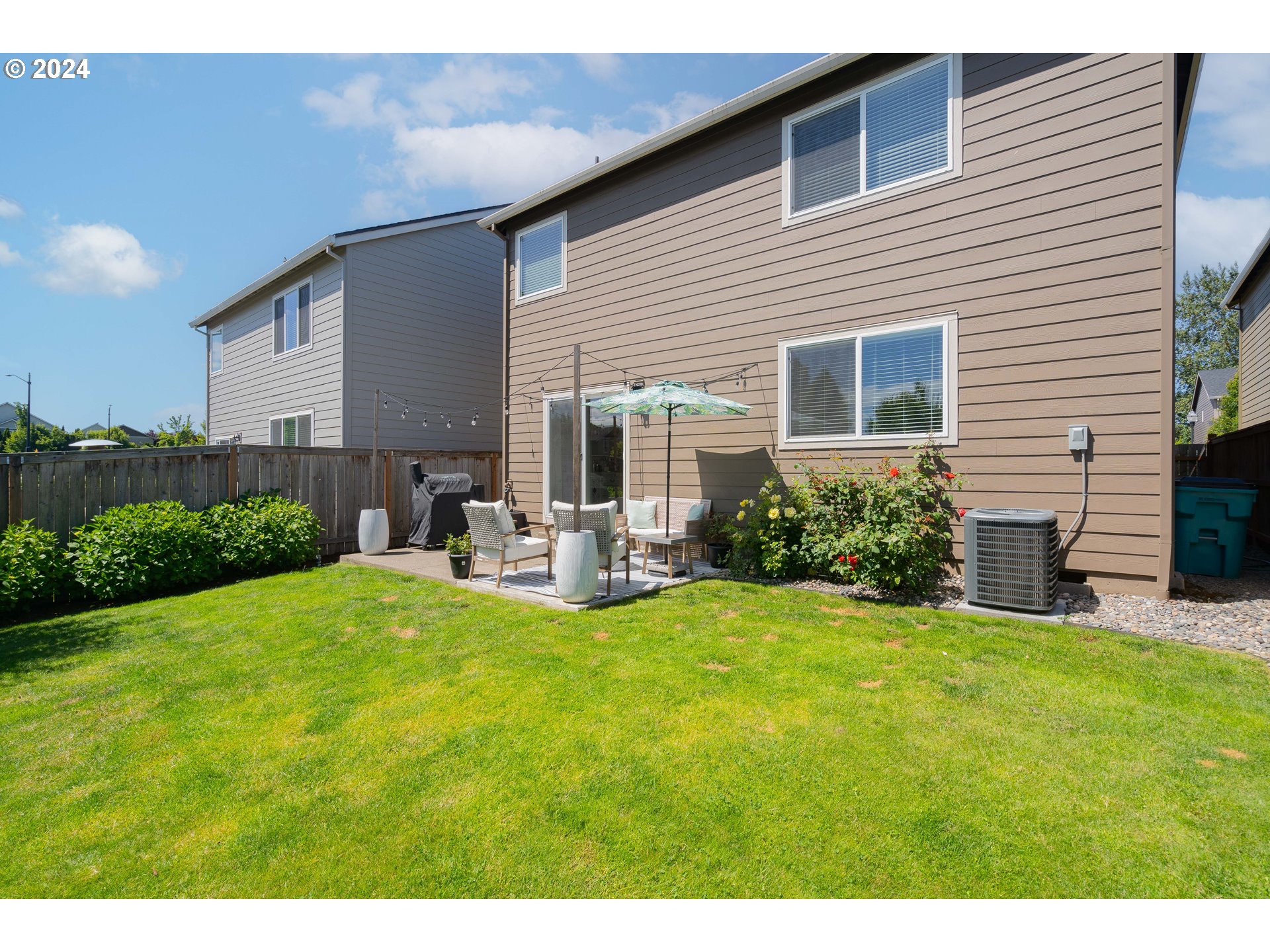 122 North 34th Court Ridgefield, WA 98642 - Photo 46 of 48 a view of a house with backyard and sitting area