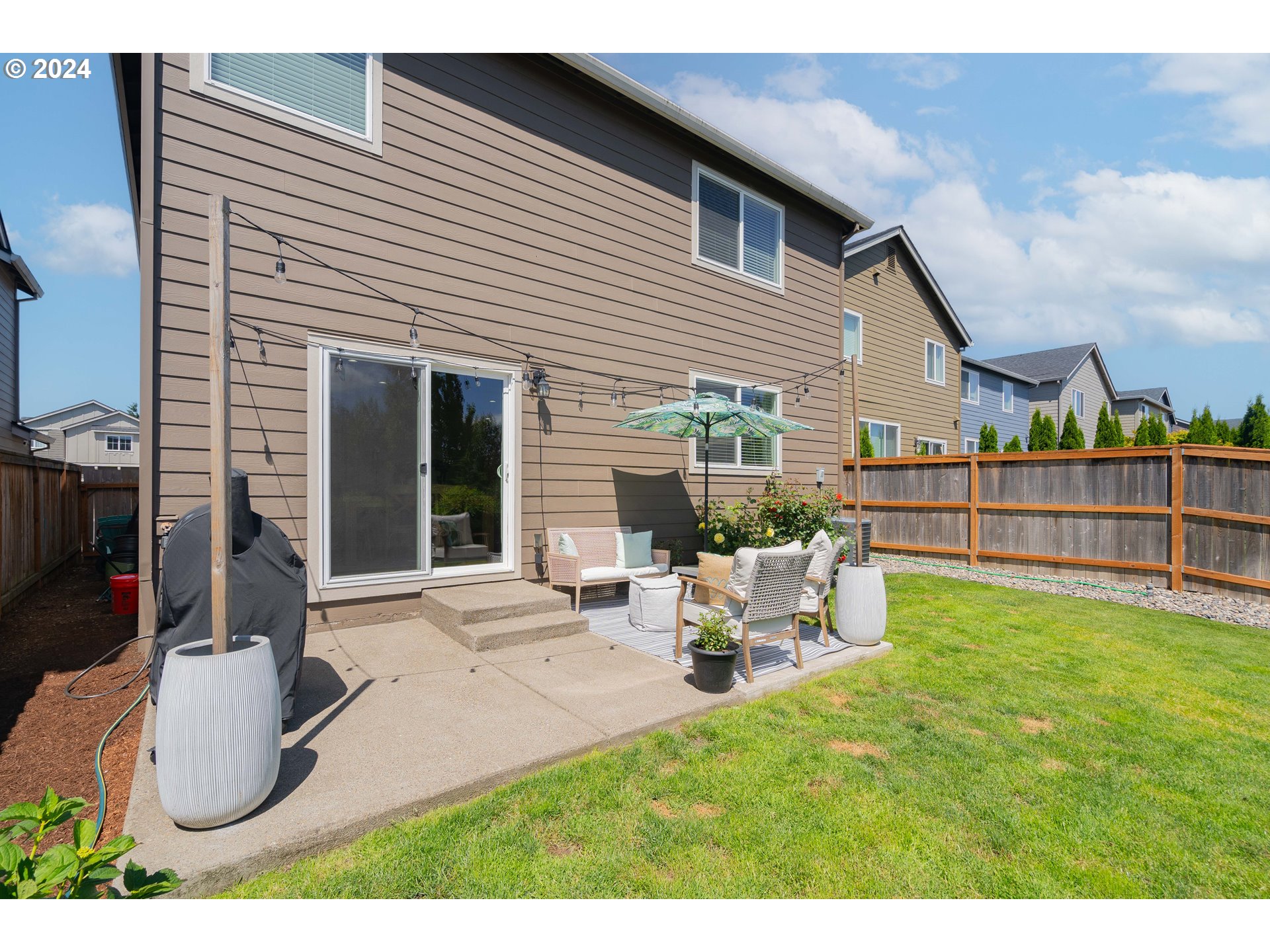 122 North 34th Court Ridgefield, WA 98642 - Photo 47 of 48 a view of a house with yard and sitting area