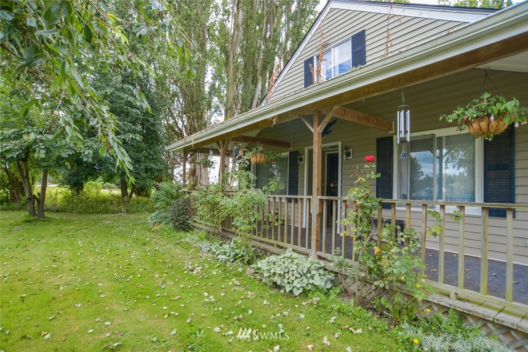 13392 Avon Allen Road Mount Vernon, WA 98273 - Photo 2 of 40 a view of house with a yard and potted plants