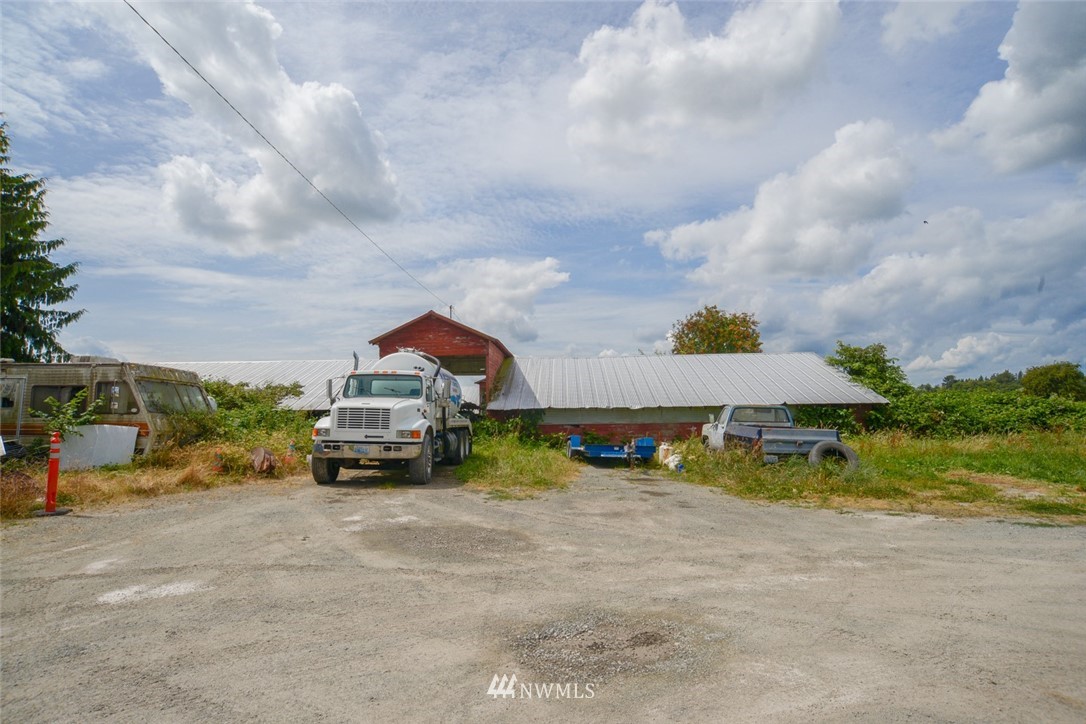 13392 Avon Allen Road Mount Vernon, WA 98273 - Photo 11 of 40 a view of yard with car parked beside of it