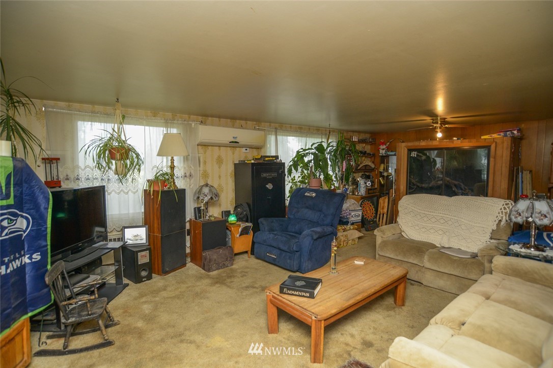 13392 Avon Allen Road Mount Vernon, WA 98273 - Photo 16 of 40 a living room with furniture a flat screen tv and a window
