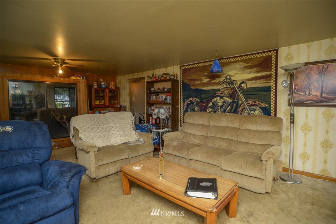 13392 Avon Allen Road Mount Vernon, WA 98273 - Photo 17 of 40 a living room with furniture a red couch and a table