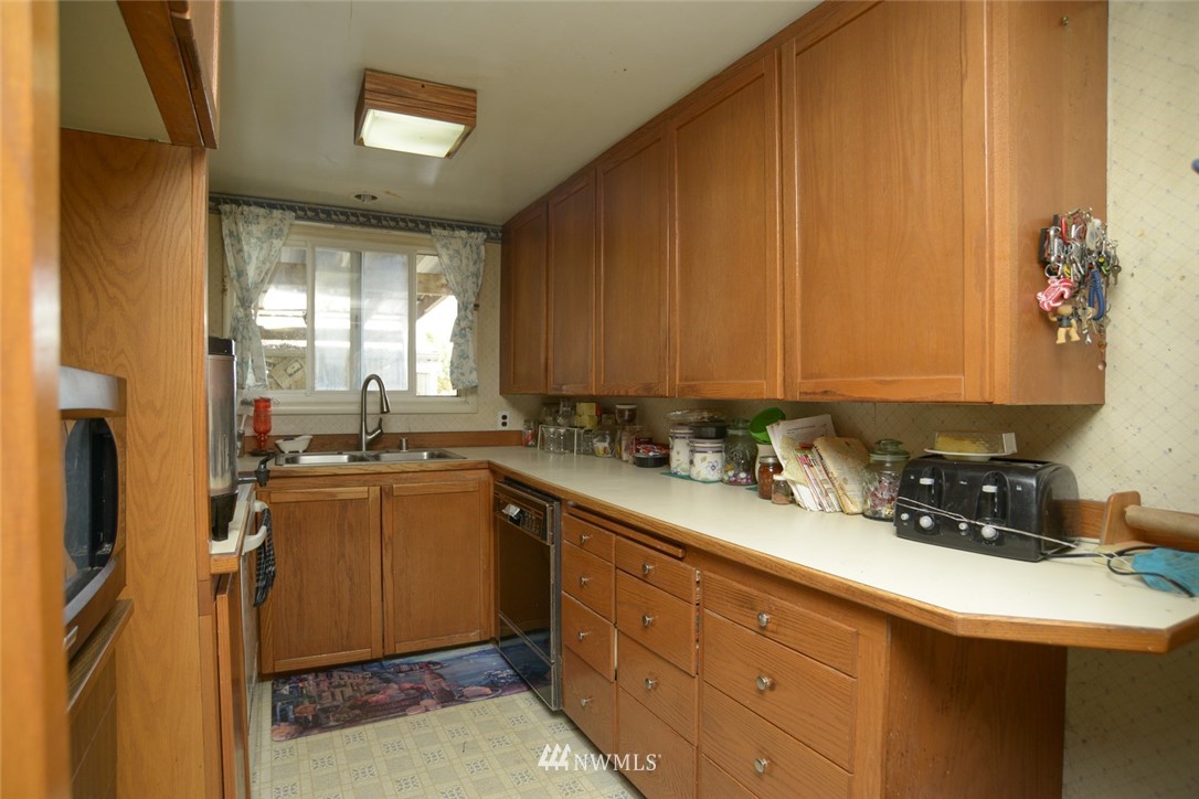 13392 Avon Allen Road Mount Vernon, WA 98273 - Photo 21 of 40 a kitchen with sink and cabinets