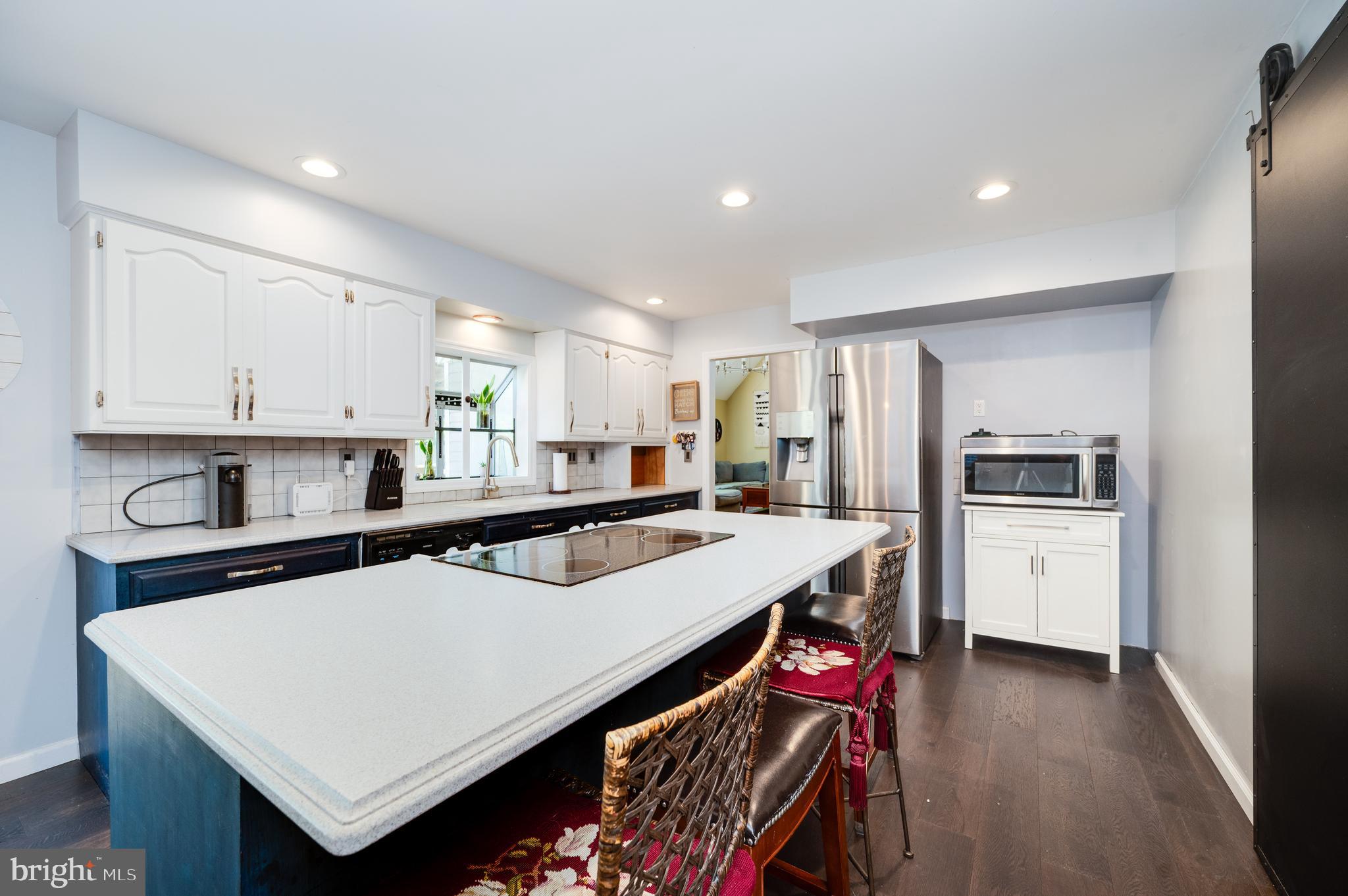 510 Greenhowe Drive Lititz, PA 17543 - Photo 14 of 31 a kitchen with stainless steel appliances a stove refrigerator sink and cabinets