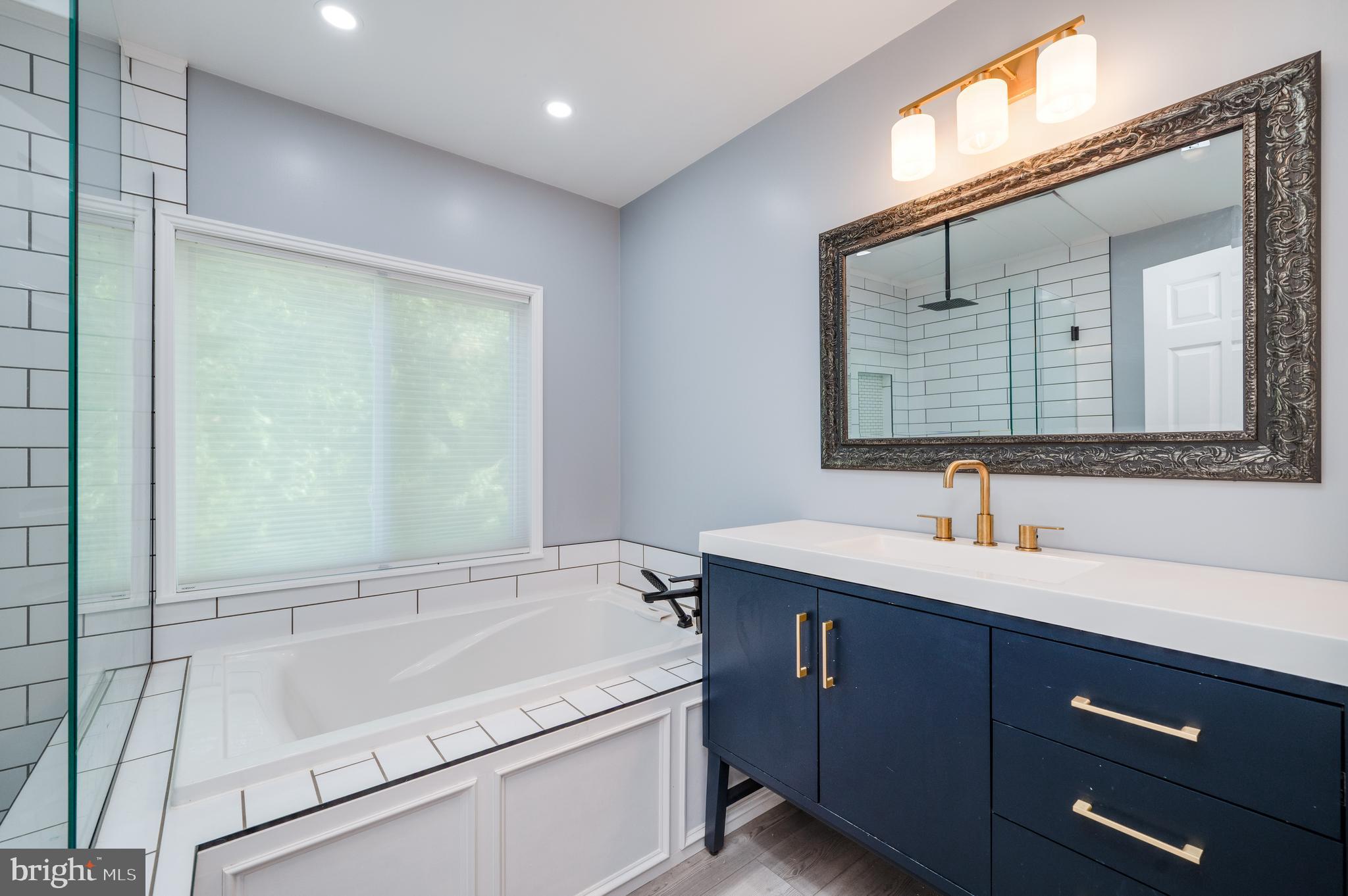 510 Greenhowe Drive Lititz, PA 17543 - Photo 25 of 31 a bathroom with a tub a sink and mirror