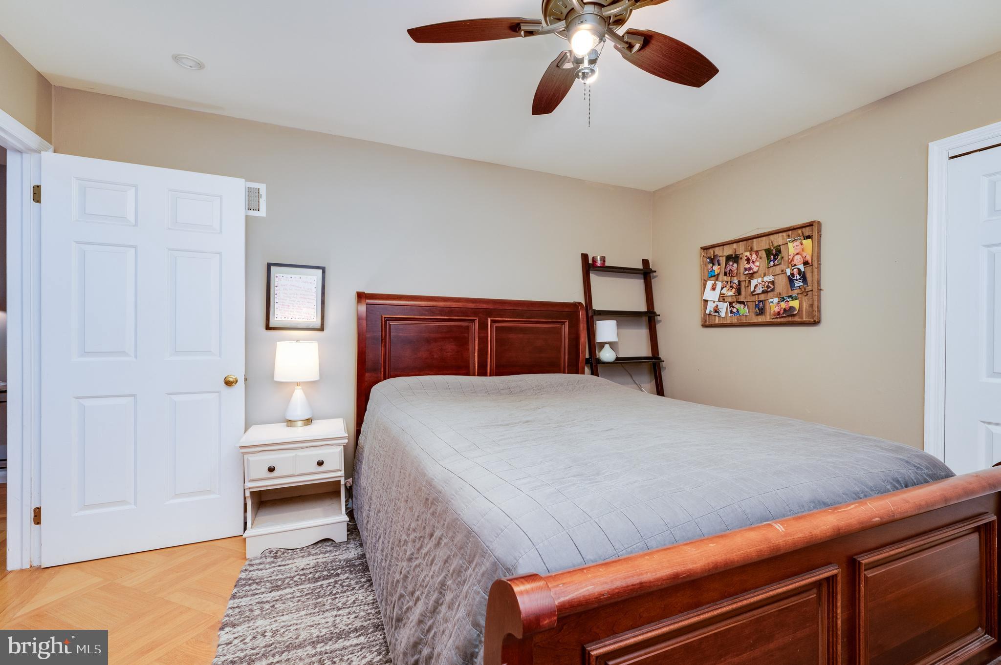 510 Greenhowe Drive Lititz, PA 17543 - Photo 26 of 31 a bedroom with a bed and a chandelier