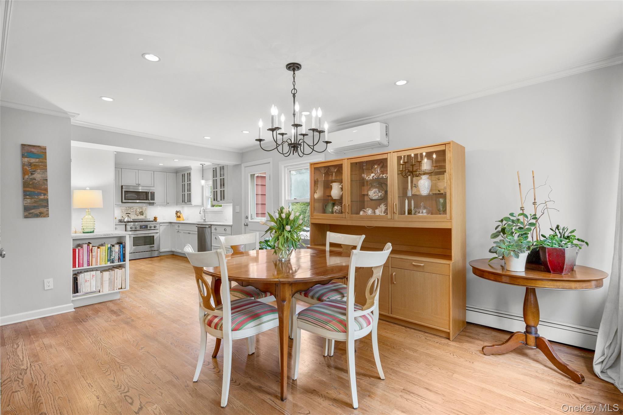 925 Old Boston Post Road Mamaroneck, NY 10543 - Photo 11 of 26 a view of a dining room with furniture and chandelier
