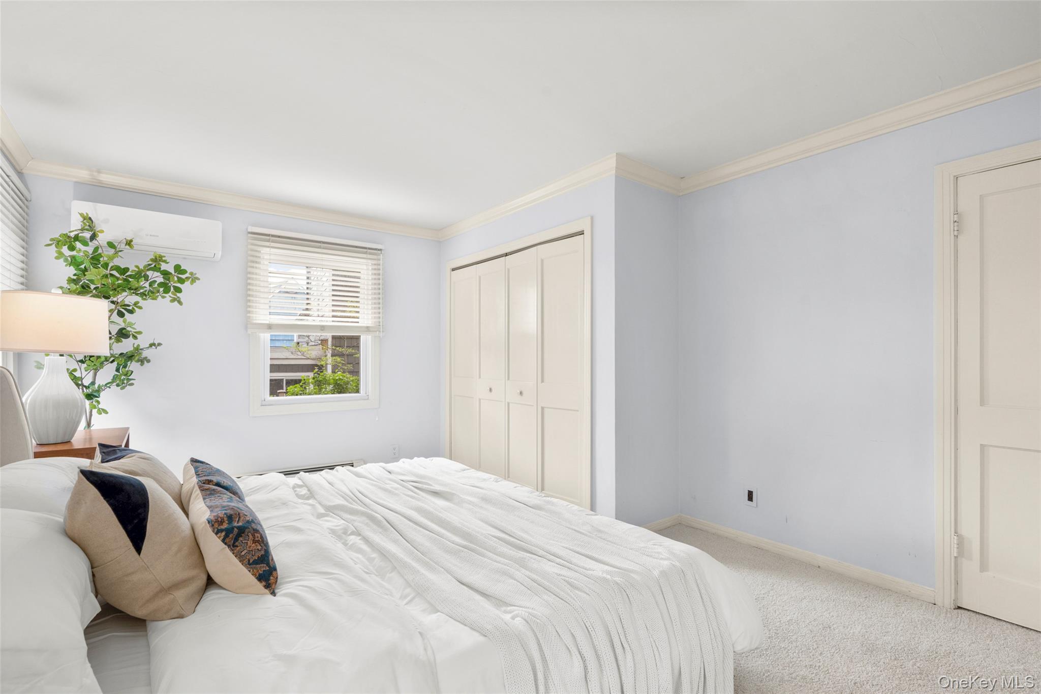 925 Old Boston Post Road Mamaroneck, NY 10543 - Photo 14 of 26 a bedroom with a bed and a window