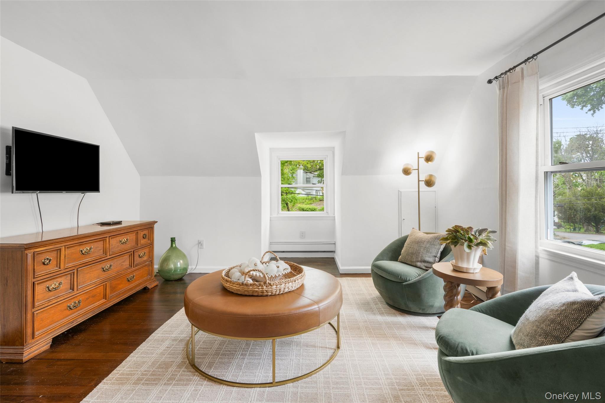 925 Old Boston Post Road Mamaroneck, NY 10543 - Photo 16 of 26 a living room with furniture and a flat screen tv