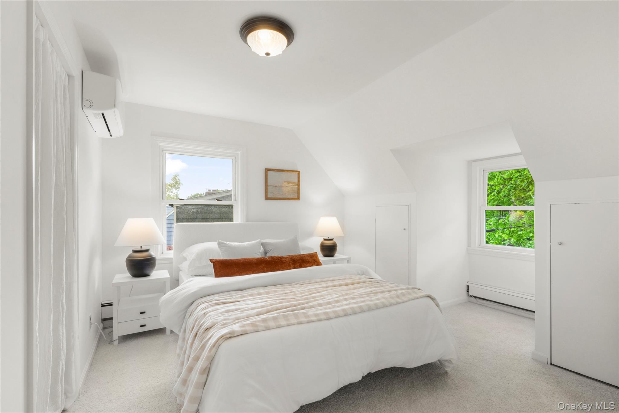 925 Old Boston Post Road Mamaroneck, NY 10543 - Photo 19 of 26 a bedroom with a bed and a window