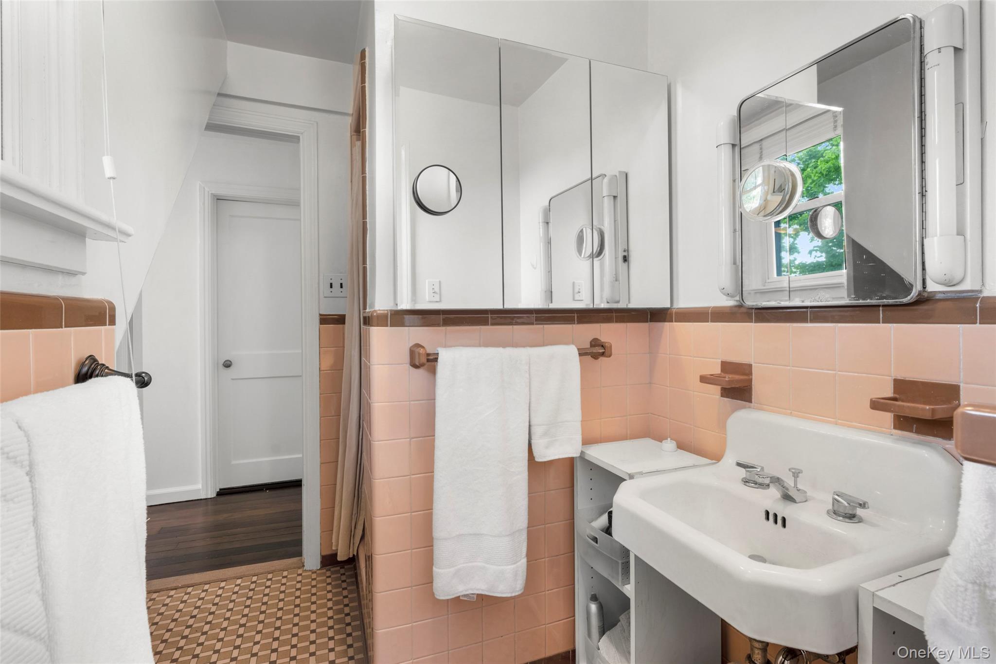 925 Old Boston Post Road Mamaroneck, NY 10543 - Photo 20 of 26 a bathroom with a sink and a mirror