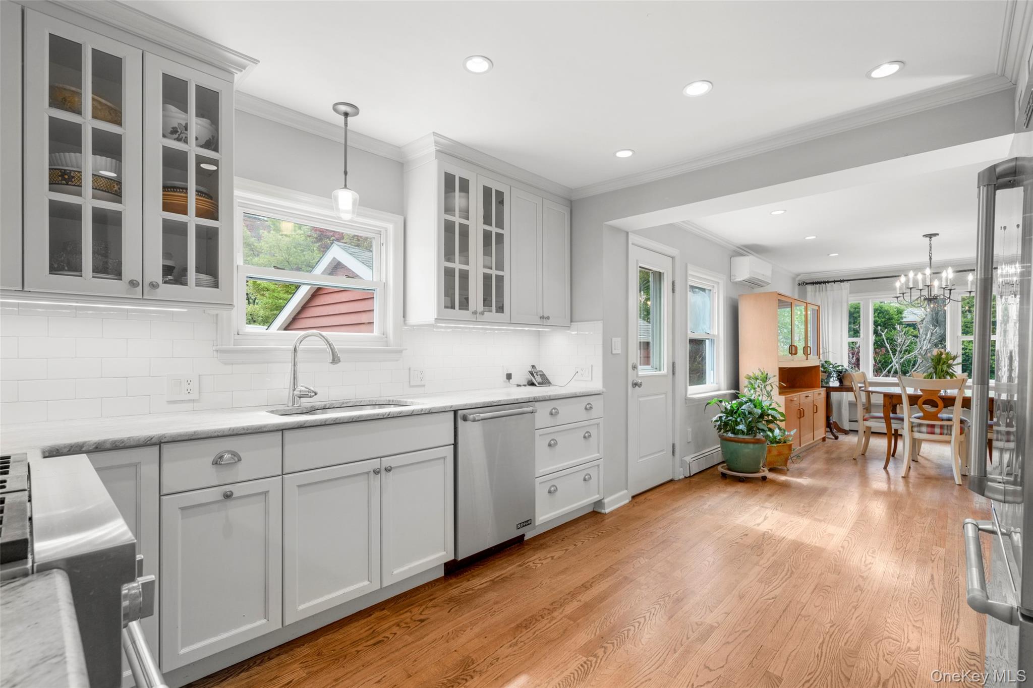 925 Old Boston Post Road Mamaroneck, NY 10543 - Photo 5 of 26 a large white kitchen with a large window