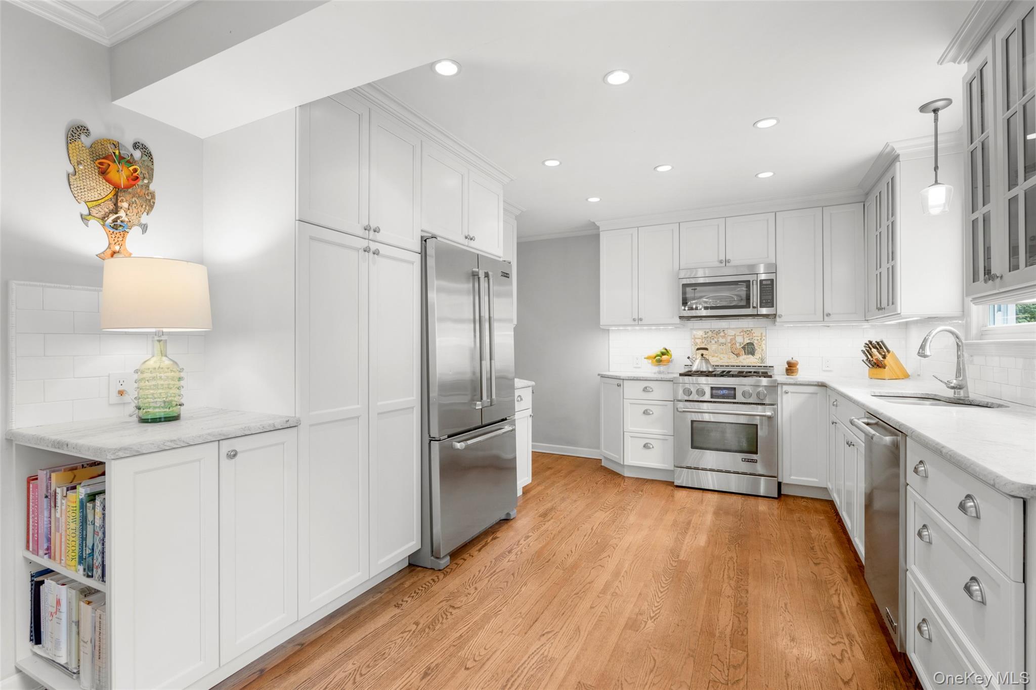 925 Old Boston Post Road Mamaroneck, NY 10543 - Photo 7 of 26 a kitchen with stainless steel appliances a refrigerator sink and microwave