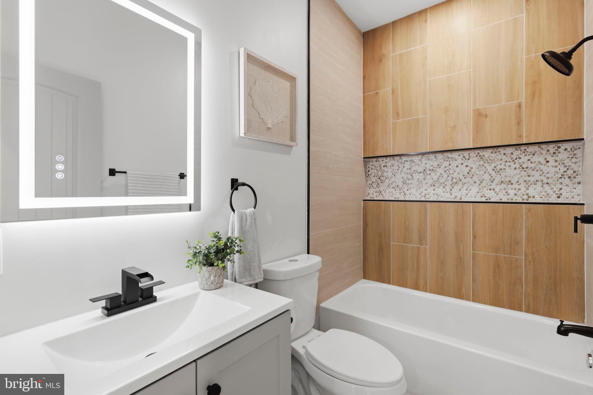 4019 Ridgecroft Road Baltimore, MD 21206 - Photo 26 of 39 Sleek modern bathroom with natural accents.