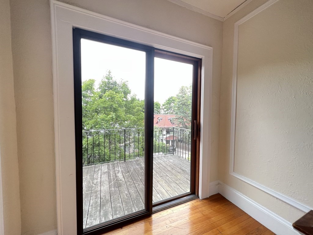 84 Winthrop Road Brookline, MA 02445 - Photo 18 of 42 a view of a room that has a large window