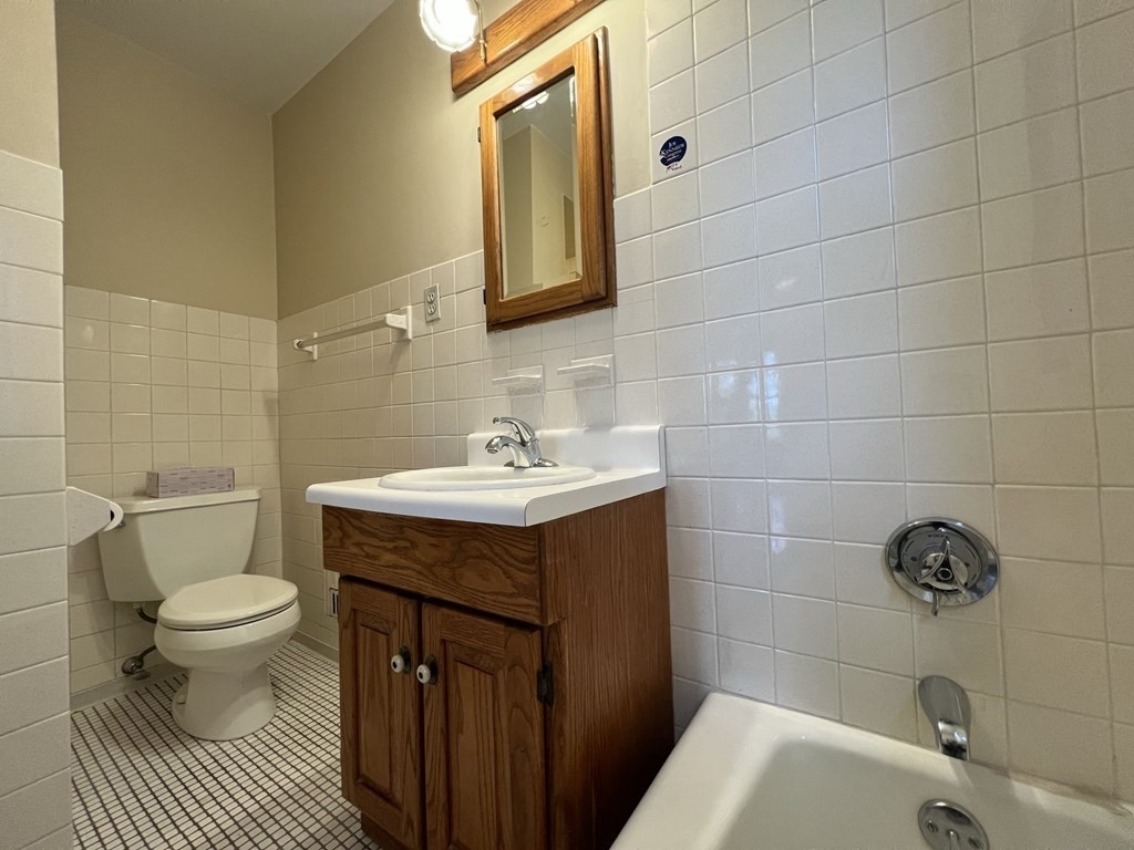 84 Winthrop Road Brookline, MA 02445 - Photo 29 of 42 a bathroom with a sink toilet and shower