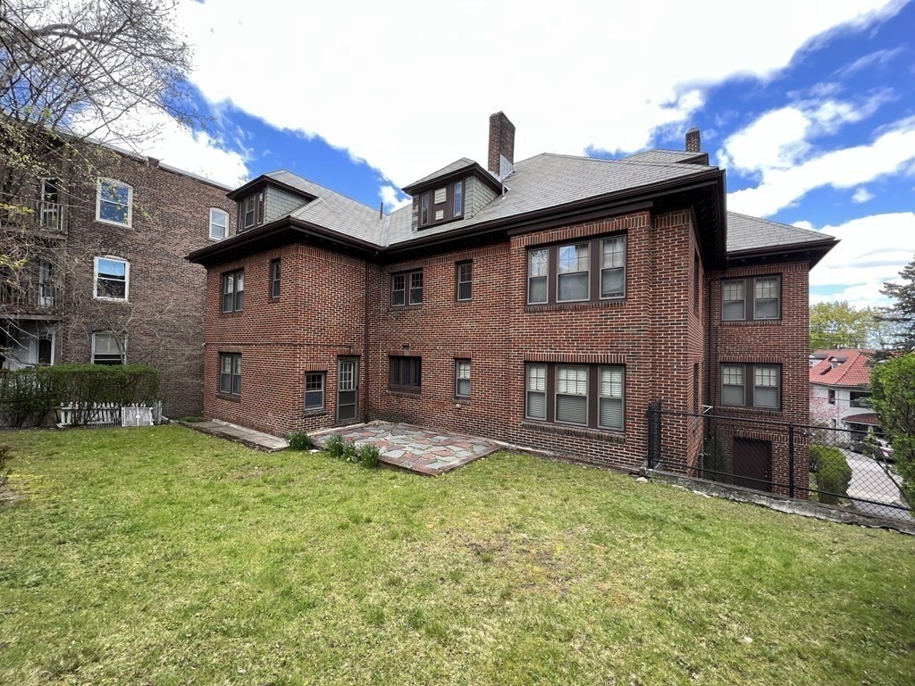 84 Winthrop Road Brookline, MA 02445 - Photo 39 of 42 a front view of a house with garden