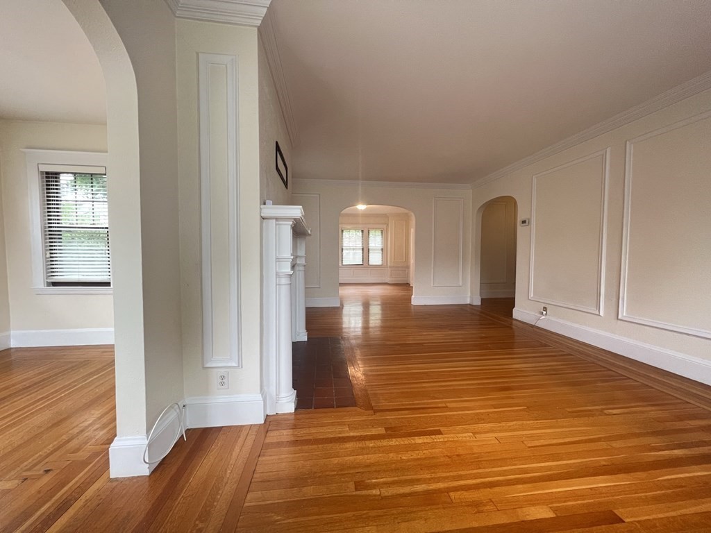 84 Winthrop Road Brookline, MA 02445 - Photo 5 of 42 a view of empty room with wooden floor and fan