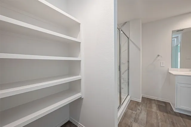 a view of an empty walk in closet