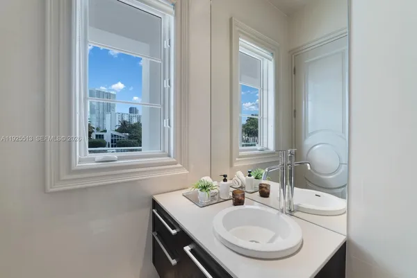 a bathroom with a sink and a mirror