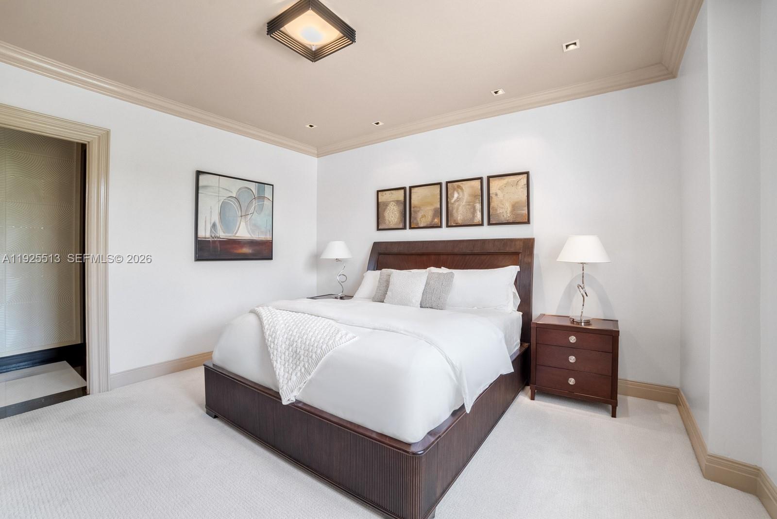 142 South Island Road Golden Beach, FL 33160 - Photo 24 of 55 a bedroom with a bed and painting on the wall