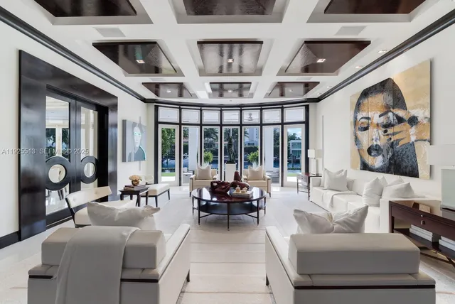 a living room with furniture and large window