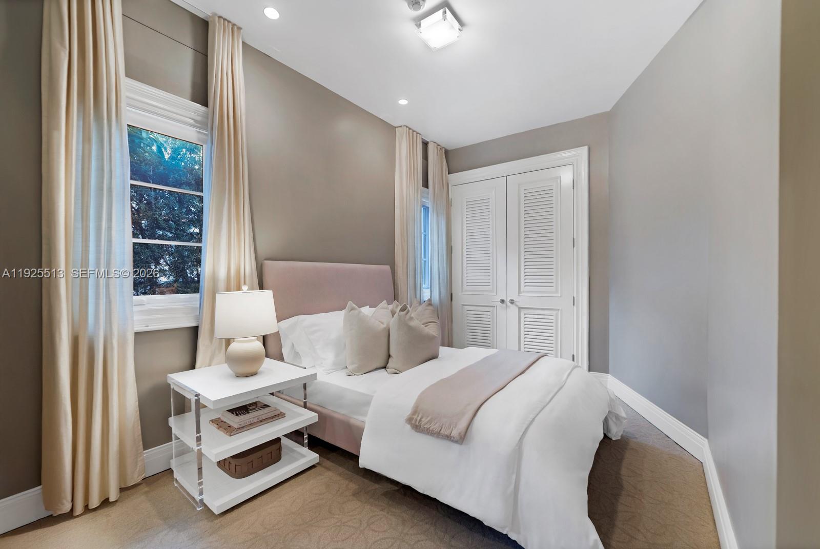 142 South Island Road Golden Beach, FL 33160 - Photo 31 of 55 a bedroom with a bed and walk in closet