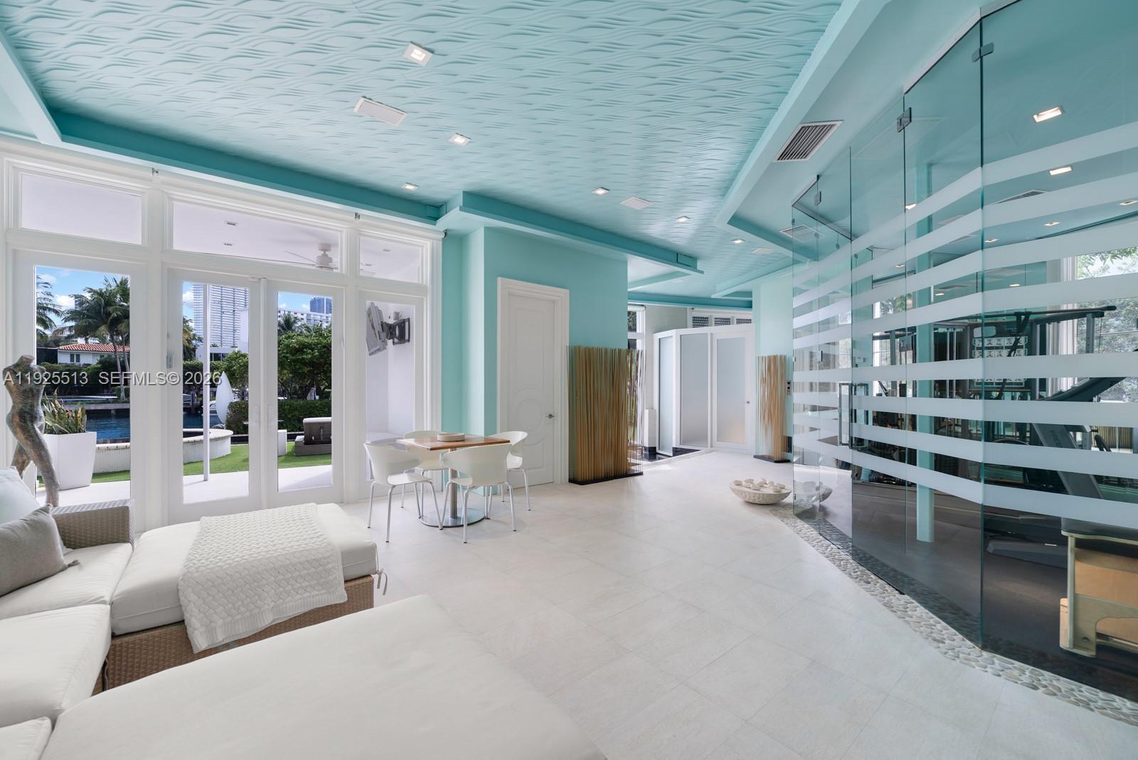 142 South Island Road Golden Beach, FL 33160 - Photo 34 of 55 a living room with furniture a table and chairs