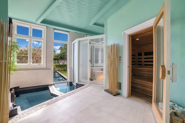 a living room with furniture and a mirror