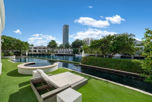 a aerial view of a house with balcony and swimming pool