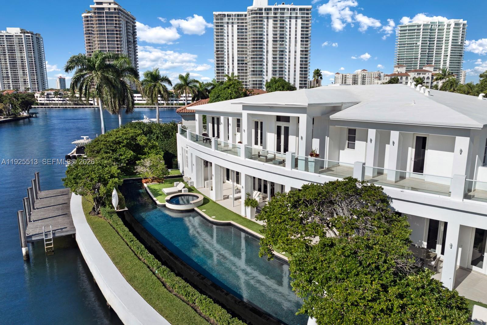 142 South Island Road Golden Beach, FL 33160 - Photo 49 of 55 a aerial view of a house with balcony and swimming pool