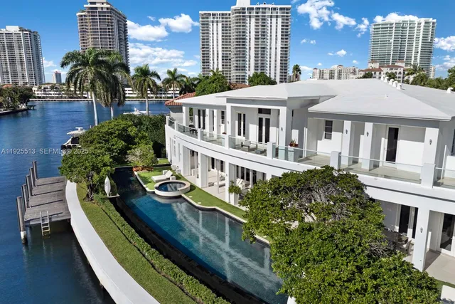 an aerial view of a house with garden space and street view