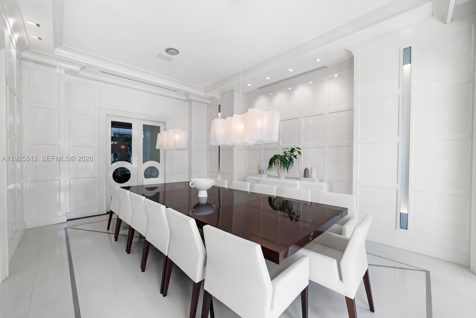 142 South Island Road Golden Beach, FL 33160 - Photo 6 of 55 a dining room with furniture and wooden floor