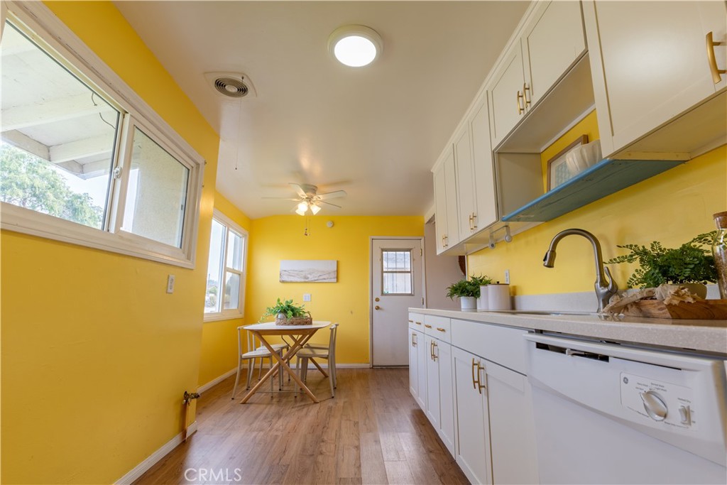 660 Armstead Street Glendora, CA 91740 - Photo 3 of 7 a kitchen with stainless steel appliances granite countertop a sink cabinets and wooden floor