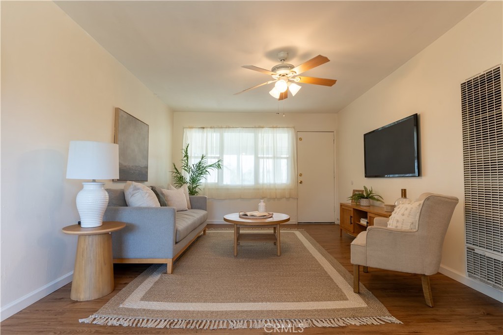 660 Armstead Street Glendora, CA 91740 - Photo 4 of 7 a living room with furniture a flat screen tv and a fireplace