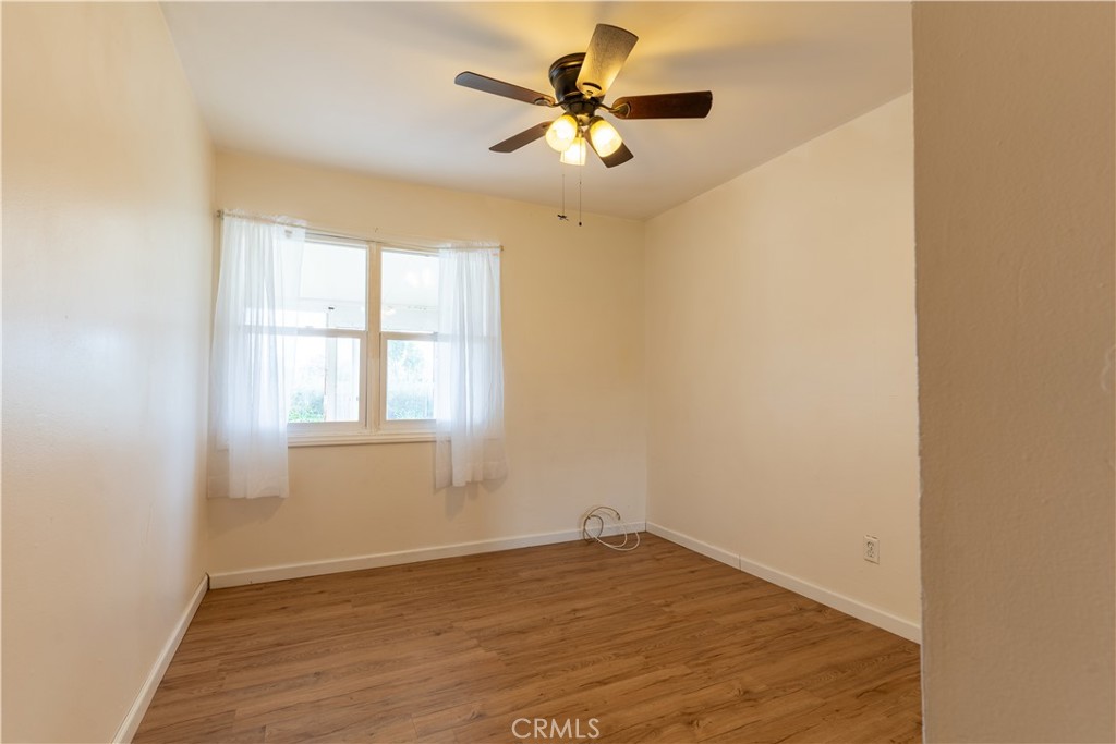 660 Armstead Street Glendora, CA 91740 - Photo 7 of 7 an empty room with a window and a ceiling fan