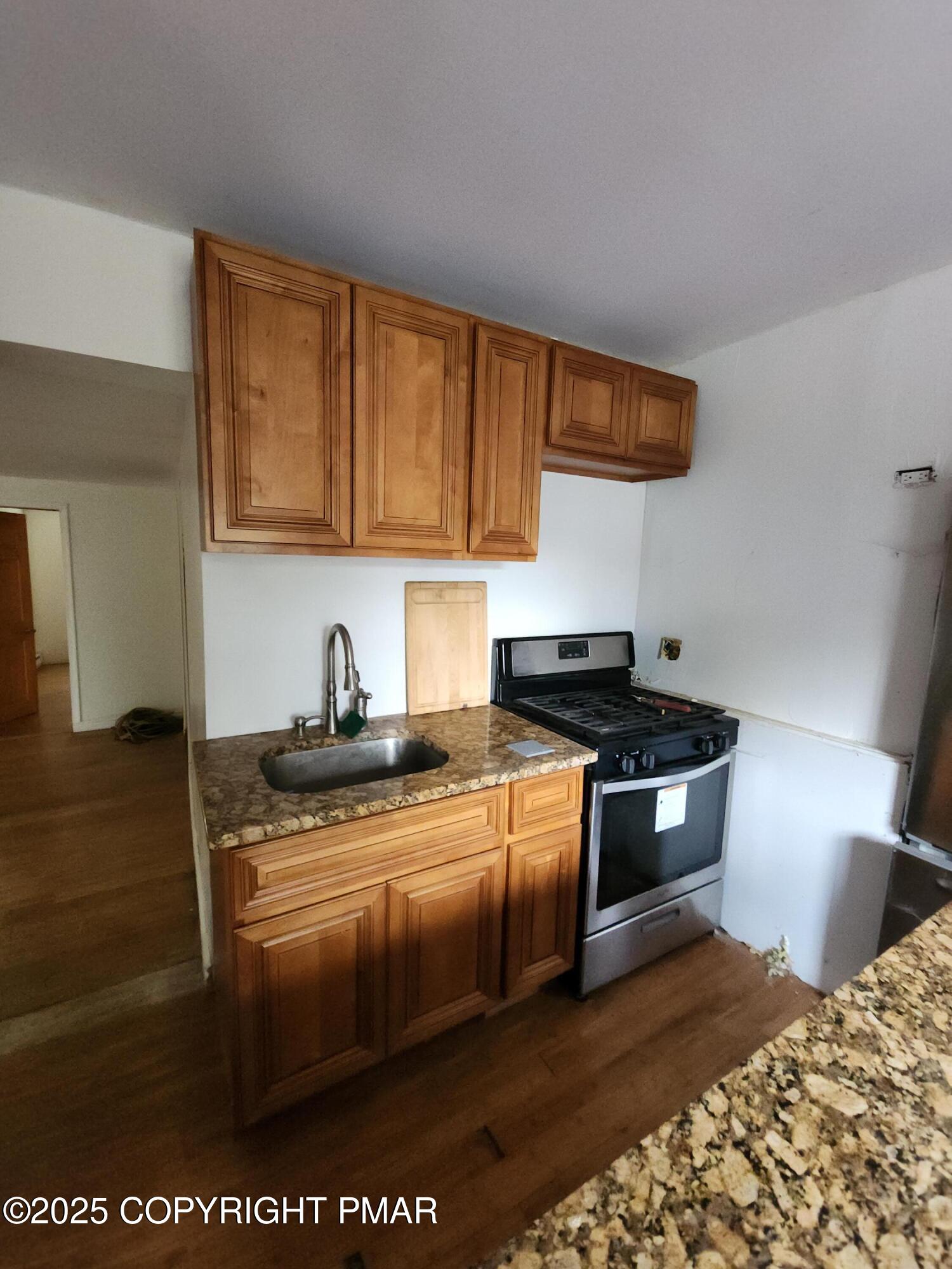 280 Coolbaugh Road East Stroudsburg, PA 18302 - Photo 12 of 40 a kitchen with stainless steel appliances granite countertop a stove a sink and a microwave