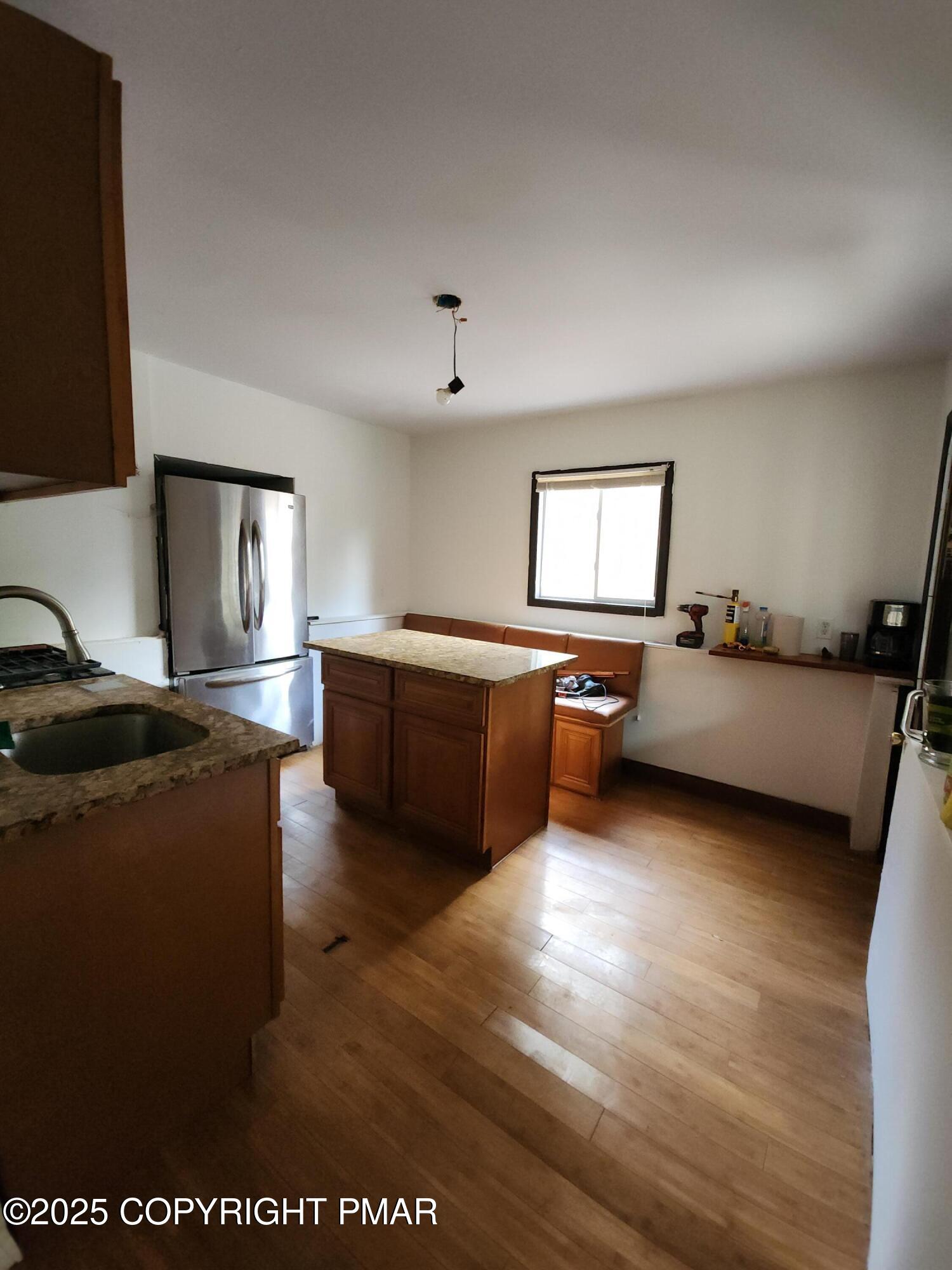 280 Coolbaugh Road East Stroudsburg, PA 18302 - Photo 13 of 40 a living room with furniture and a flat screen tv