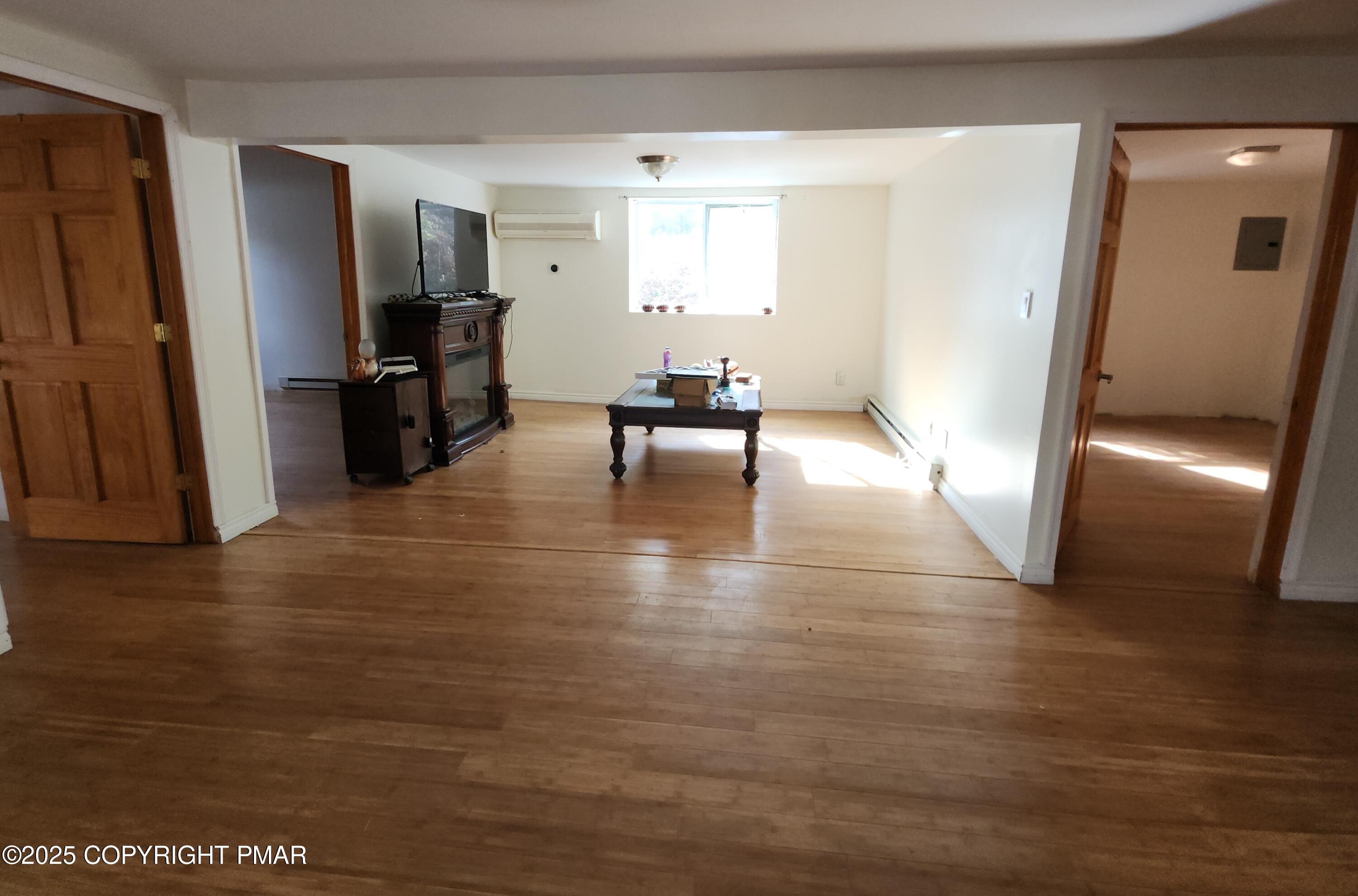 280 Coolbaugh Road East Stroudsburg, PA 18302 - Photo 15 of 40 a living room with furniture and a dining table