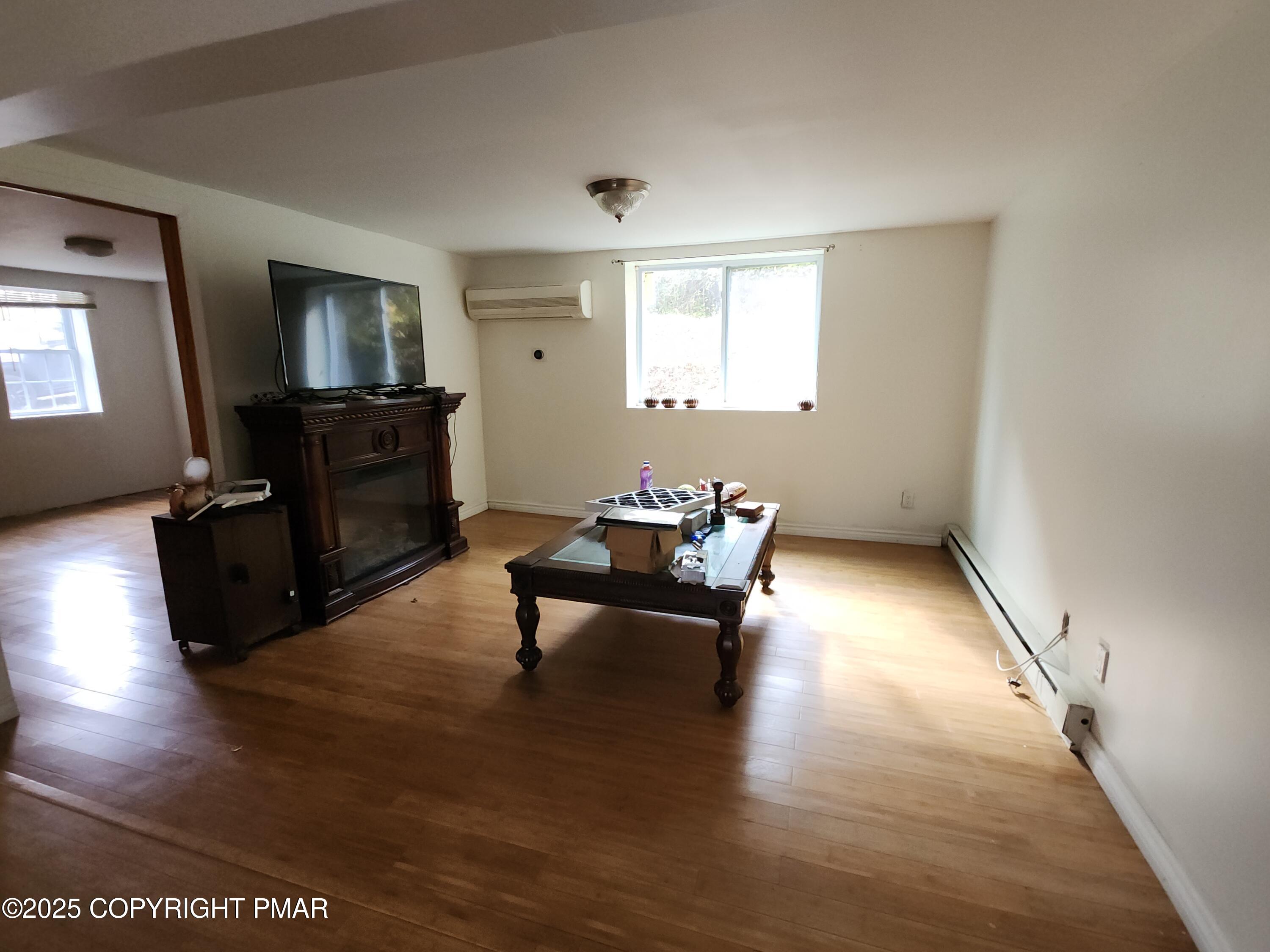 280 Coolbaugh Road East Stroudsburg, PA 18302 - Photo 18 of 40 a living room with furniture and a wooden floor