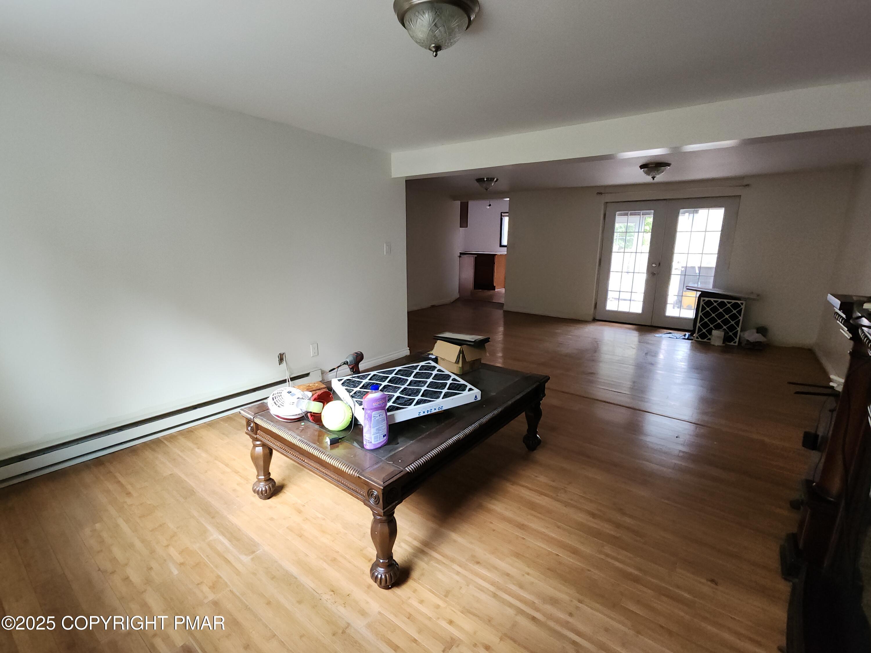 280 Coolbaugh Road East Stroudsburg, PA 18302 - Photo 19 of 40 a living room with furniture and a table