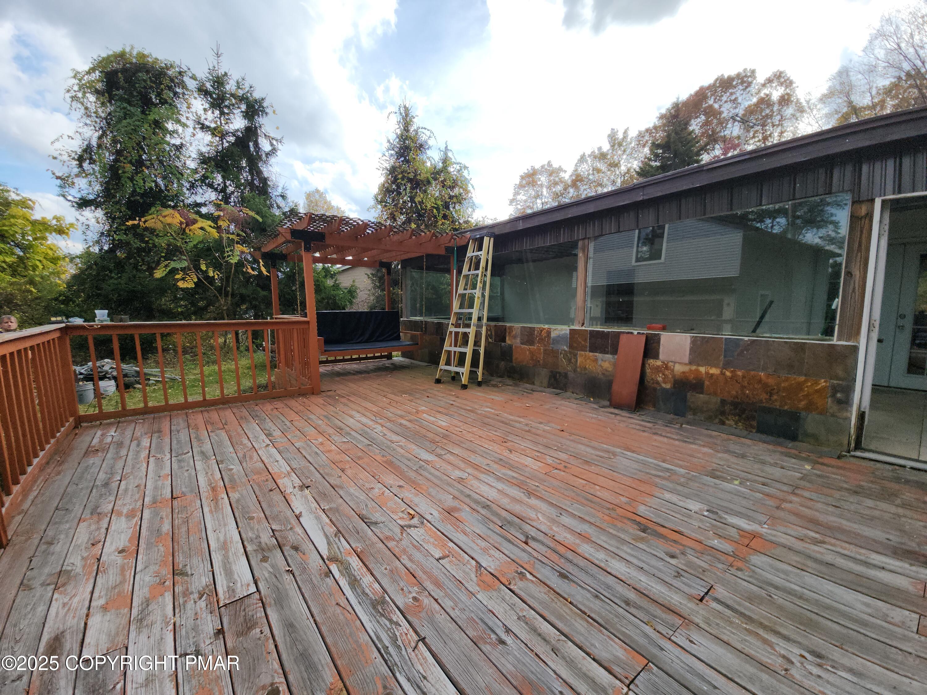 280 Coolbaugh Road East Stroudsburg, PA 18302 - Photo 5 of 40 a view of deck with wooden floor and seating space