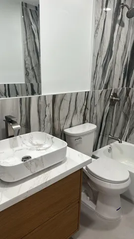 a bathroom with a toilet and a sink