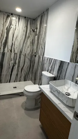 a bathroom with a sink and a toilet