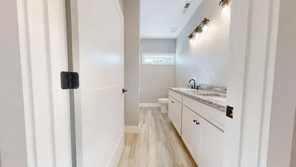 a kitchen with a stove and a refrigerator